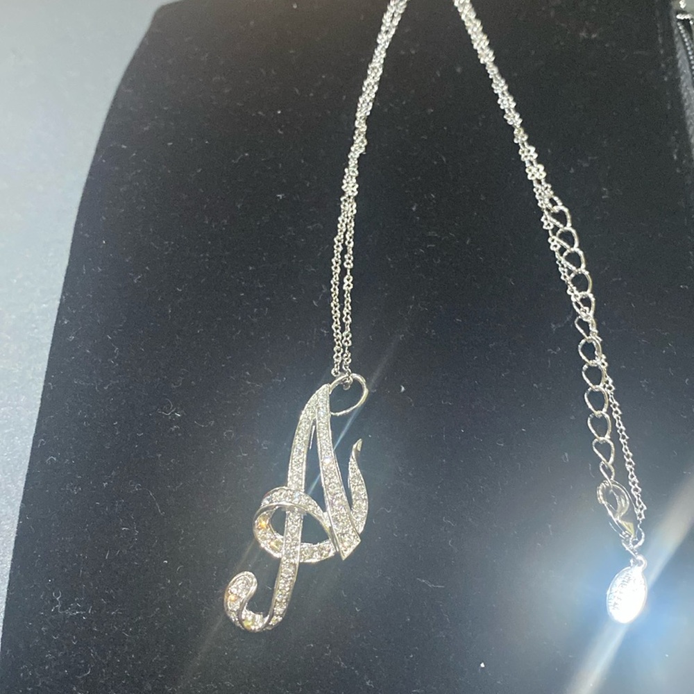 Nolan Miller silver chain necklace, with Letter A charm.